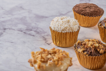 Brigadeiro is a common Brazilian dessert. Delicious chocolate candy Brigadeiro on a table