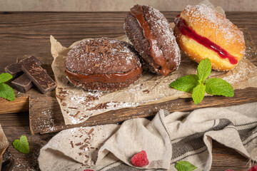 Bolas de Berlim, or Berlin Balls. Portuguese fried dough with sugar, Filled with chocolate or raspberry jam. Portuguese fried dough with sugar.