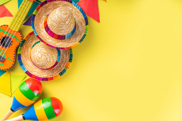 Mexican Cinco de Mayo holiday background with mexican cactus,guitars, sombrero hat, maracas, Bright...