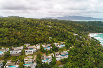 Fototapeta na wymiar Aerial sea island with villa resort hotel in tropical rainforest