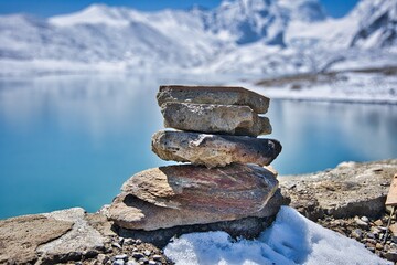 Gurudongmar Lake with snow covered and beautiful lake view one of the best place to visit and enjoy during vacation. Snow capped mountains with breath taking view and is perfect for wallpaper