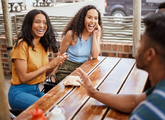 Great conversations are shared over a good meal. Shot of a group of young friends hanging out together at a restaurant. - obrazy, fototapety, plakaty