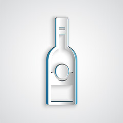 Paper cut Glass bottle of vodka icon isolated on grey background. Paper art style. Vector