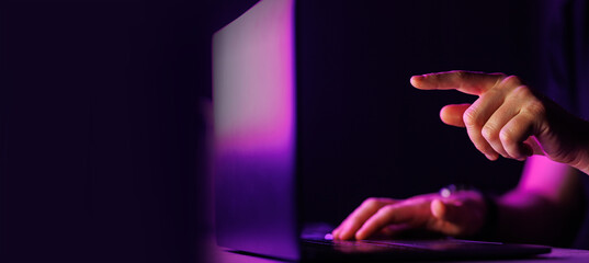 Close-up shot of Man typing on laptop with text free space on the side. Business, computer, coding, e-commerce concept High quality big resolution photo.