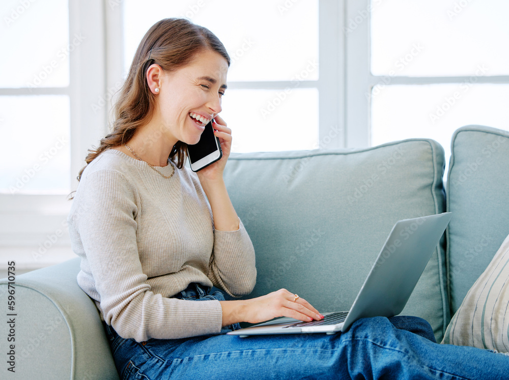 Canvas Prints Yeah Im looking at it right now. Cropped shot of an attractive young woman making a phonecall while relaxing on the sofa at home.