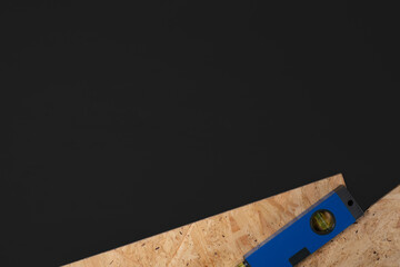 DIYイメージの水準器とOSB合板を配した黒背景素材01