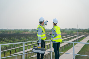 Engineer hand is installing and checking an operation of sun and cleanliness of photovoltaic solar panels, Engineer with energy measurement tool photovoltaic modules for renewable energy