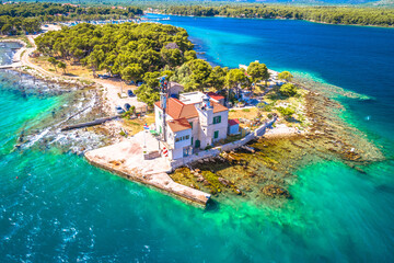 Jadrija lighthouse and beach  in Sibenik bay entrance aerial view
