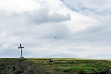 Fototapeta na wymiar Landscape with iron cross in Kamianets-Podilskyi city in Ukraine