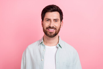 Photo portrait of handsome young guy toothy beaming smile face wear trendy blue outfit isolated on pink color background