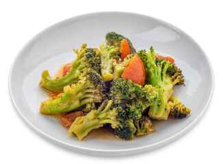 Stewed broccoli with tomato in white dish isolated