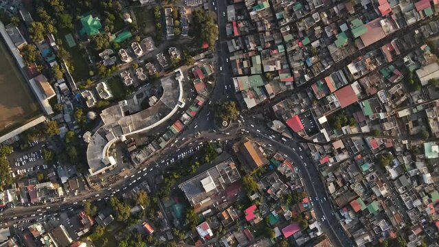 Aerial view of a small developing city in India. Rooftops of Indian houses. Drone view of traffic in the Indian Market. Indian Cityscape. Developing India. 4K