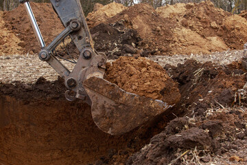 Fototapeta na wymiar Excavator boom and bucket