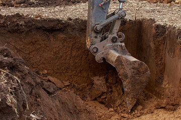 Excavator boom and bucket