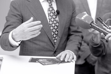 News or press conference or media interview with business person, digital voice recorder and...