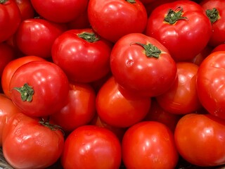group of fresh tomatoes at the supermarket 