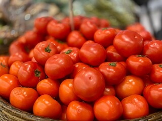 group of fresh tomatoes at the supermarket 