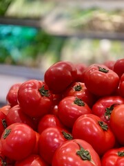 group of fresh tomatoes at the supermarket 
