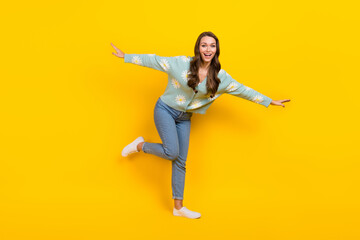 Full length photo of cheerful lovely person enjoy dancing partying isolated on yellow color background