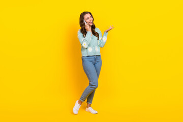 Fototapeta na wymiar Full size portrait of pretty positive girl speak communicate telephone isolated on yellow color background