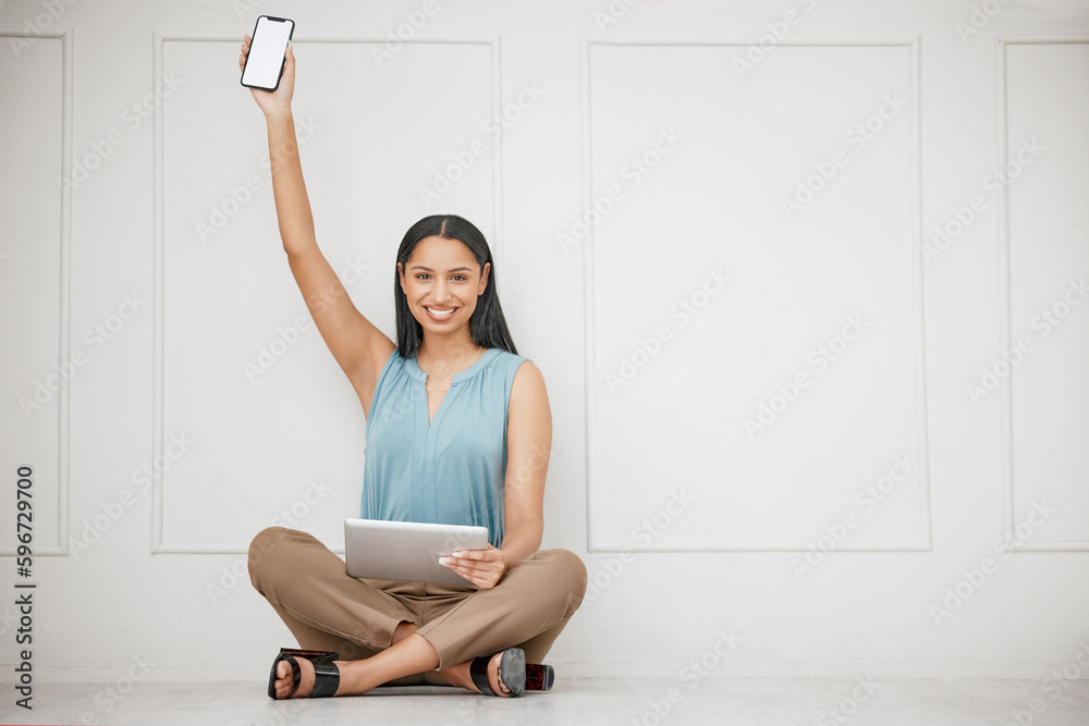 Poster smiling young businesswoman using a wireless tablet device and holding a smartphone up. portrait of 