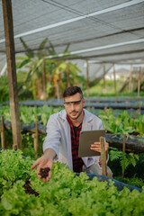 To assess the efficiency of modern greenhouse farming management, agricultural research expert inspect and collect data on crops, water, air, and insects. Performing regular laboratory procedures.