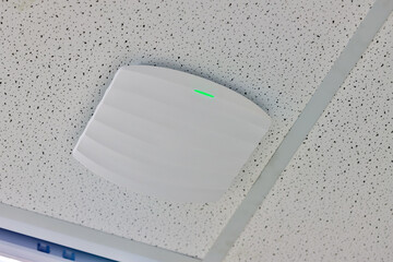 wireless router for network, hang on the ceiling. world wide network technology. WIFI router or Wireless Access Point setup at ceiling for Internet connection space. - obrazy, fototapety, plakaty
