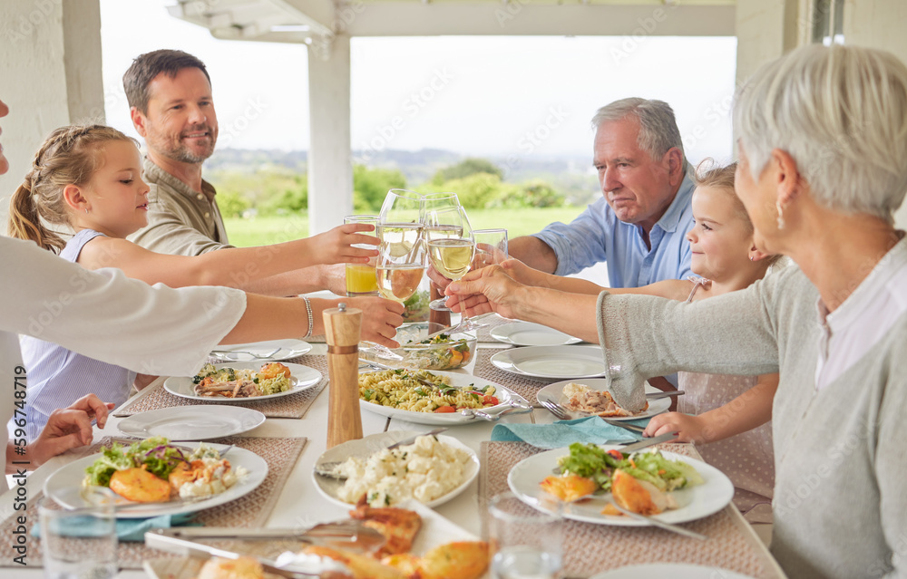 Wall mural heres to more life. shot of a family toasting during a sunday lunch.