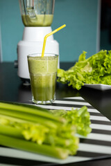 Close-up Fresh Green Smoothie from Celery, Cucumber and Apple. Healthy and Vegan Concept 