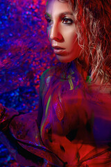 girl in neon light with glowing paints
