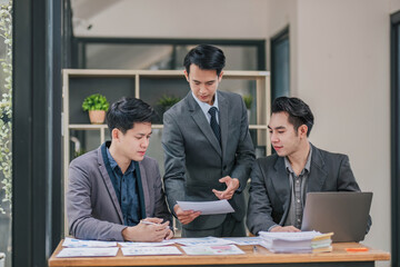 Teamwork concept.Project team making conversation at meeting room office.People using laptops and gadgets.