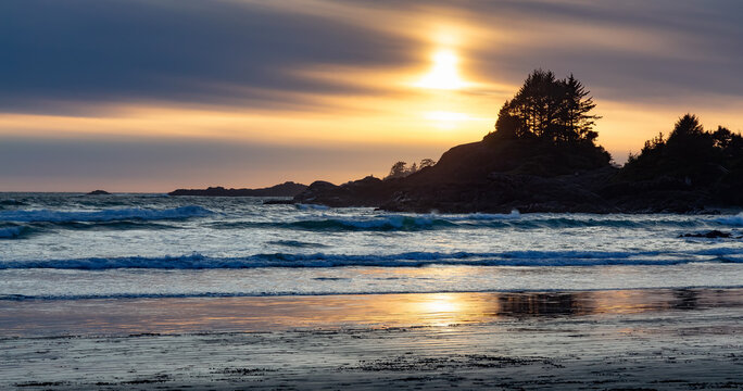 Rocky Shore on West Coast of Pacific Ocean in Tofino. Cox Bay in Vancouver Island, British Columbia, Canada. Sunset Sky. Nature Panorama