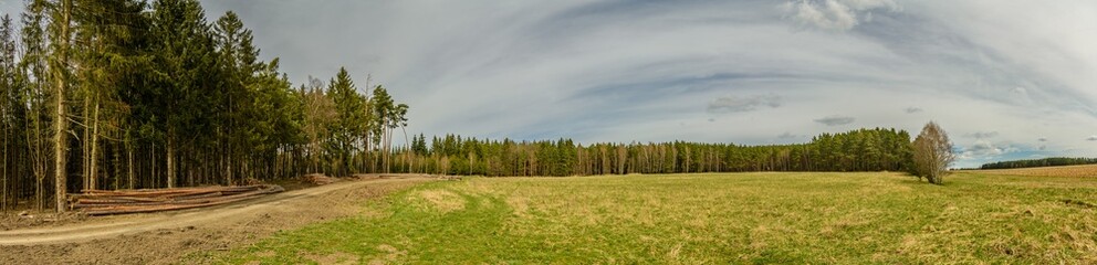 panorama of countryside with forest, meadow, wood, path