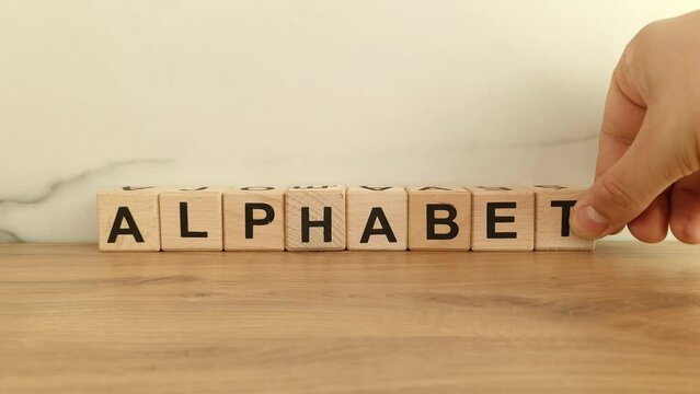 Word alphabet from wooden blocks. English language learning, education concept