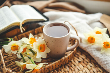 Bible, flowers, cup of tea. Christian good morning concept