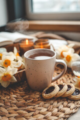 Cup of hot tea and spring home interior. good morning concept