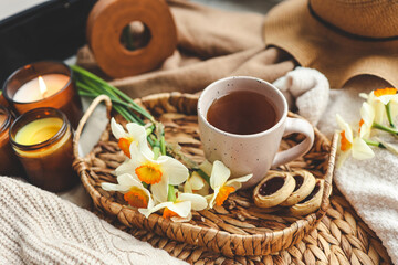 Fototapeta na wymiar Cup of hot tea and spring home interior. good morning concept