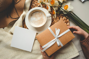 Top view spring composition, coffee cup, gift box and hat