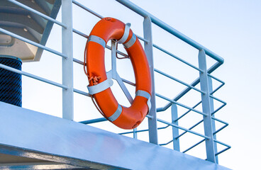 Life buoy on the deck of cruise ship.S ecurity life kit on ship's deck