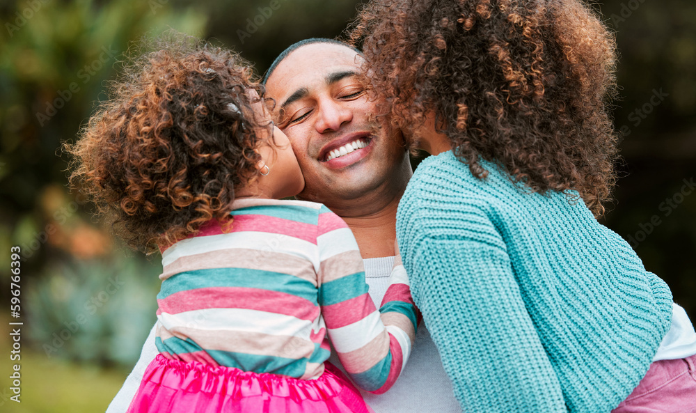 Wall mural Being a dad is the best feeling in the world. Shot of two little girls kissing their father on his cheek.