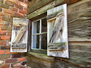 Old farmhouse window and shutters