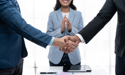 Business success. Business people handshake agreement confirmed in the investment business.