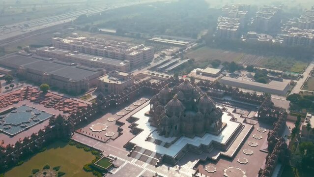 Aerial shot of Akshardham Temple in New Delhi, India. Drone view of a Hindu temple in India. Akshardham complex is a Hindu temple, and a spiritual-cultural campus in Delhi, India.