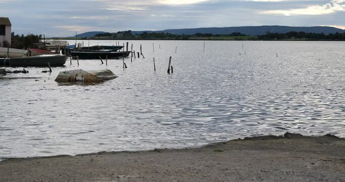 landscape on the pond of moures in the department of H&eacute;rault. Mediterranean landscape, pilou path. Fisherman's boat. 