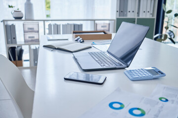 Important work in progress. Closeup shot of a laptop on a desk in an empty office.