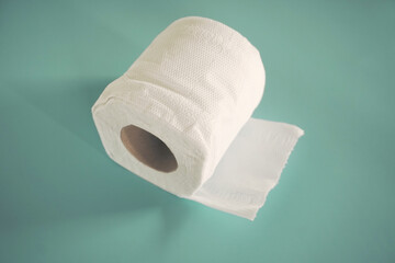 Simple toilet paper on blue background.