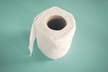 Simple toilet paper on blue background.