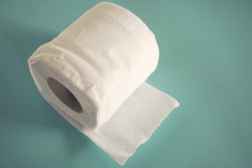 Simple toilet paper on blue background.