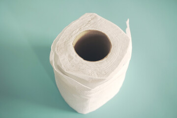 Simple toilet paper on blue background.