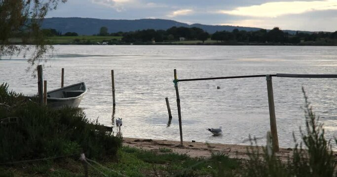 landscape on the pond of moures in the department of H&eacute;rault. Mediterranean landscape, pilou path. Fisherman's boat. 